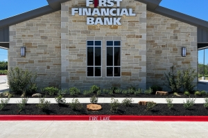 First Financial Bank Bryan TX landscape installation. rock boulder, commercial landscape