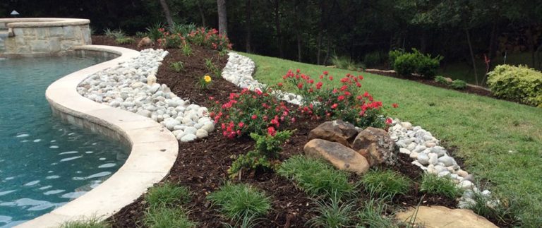 pool landscapes, bull rock around pool, landscape installation college station